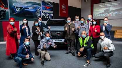 Nissan team in front of Navara