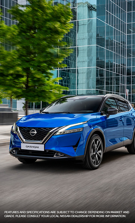 Blue Qashqai Driving in city