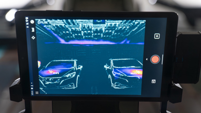 Tablet screen showing different heat signals from cars
