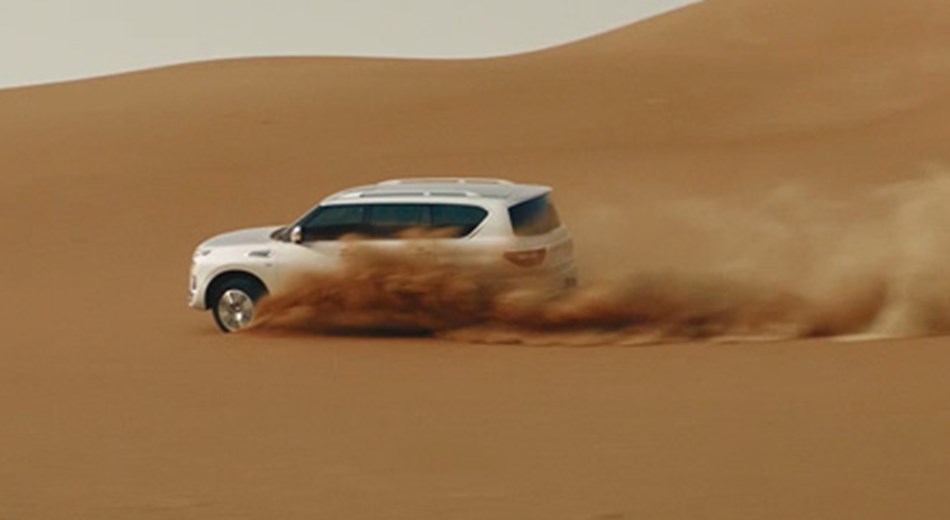 Nissan Patrol Y62 driving through desert