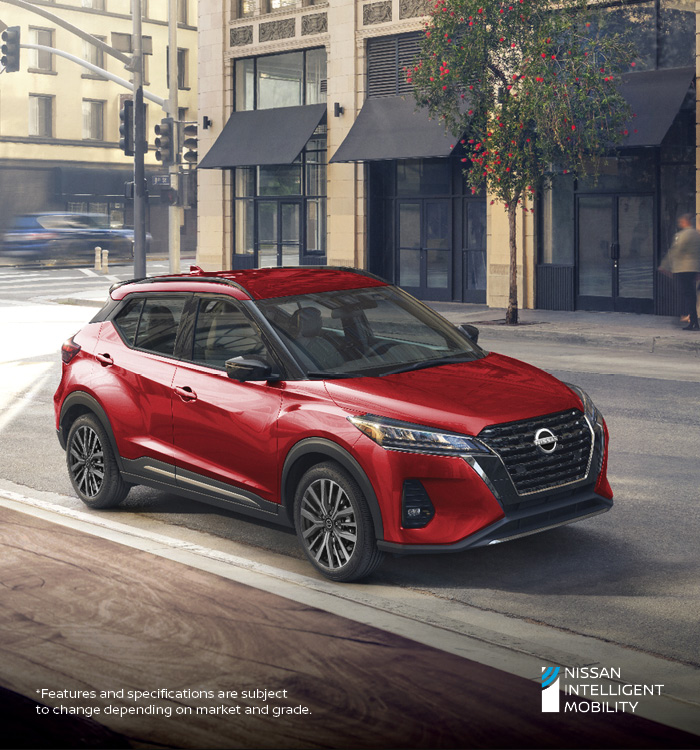 Red Nissan Kicks through coffee shop window