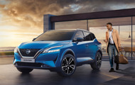 Blue Qashqai in front of building with driver approaching